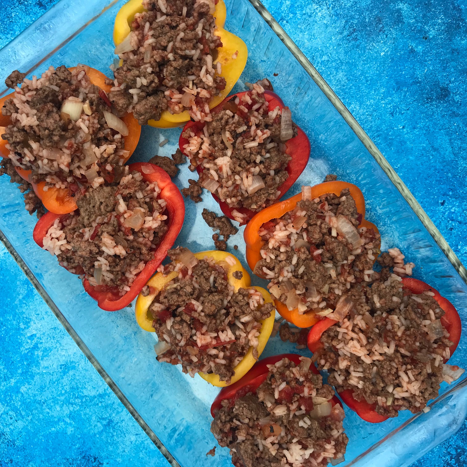 Greek Stuffed Bell Peppers are a Mediterranean twist on a family favorite weeknight classic. Made with lean Ground Beef and other kitchen staples like canned tomatoes, dried spices, and feta cheese. 